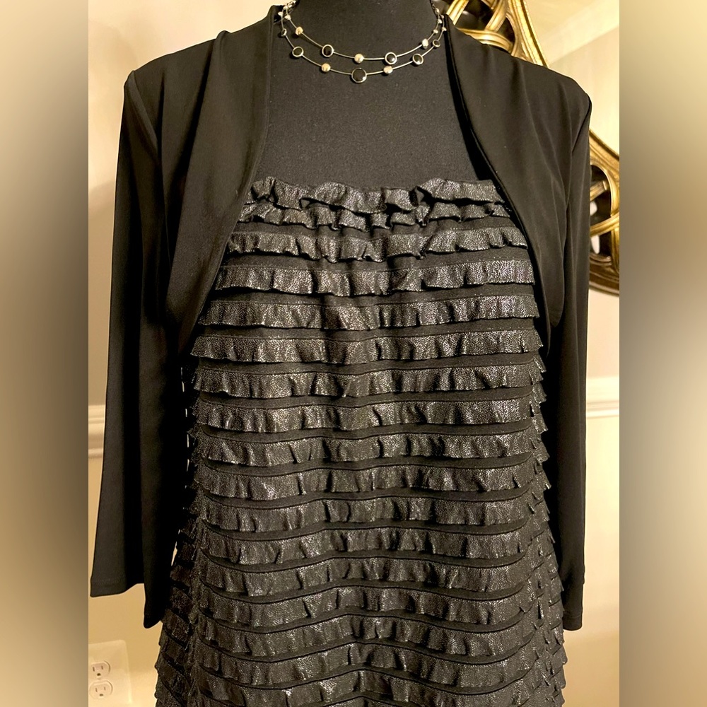 Ruffled blouse with 3/4 sleeve stretch attached/bolero style. Brand new with tag